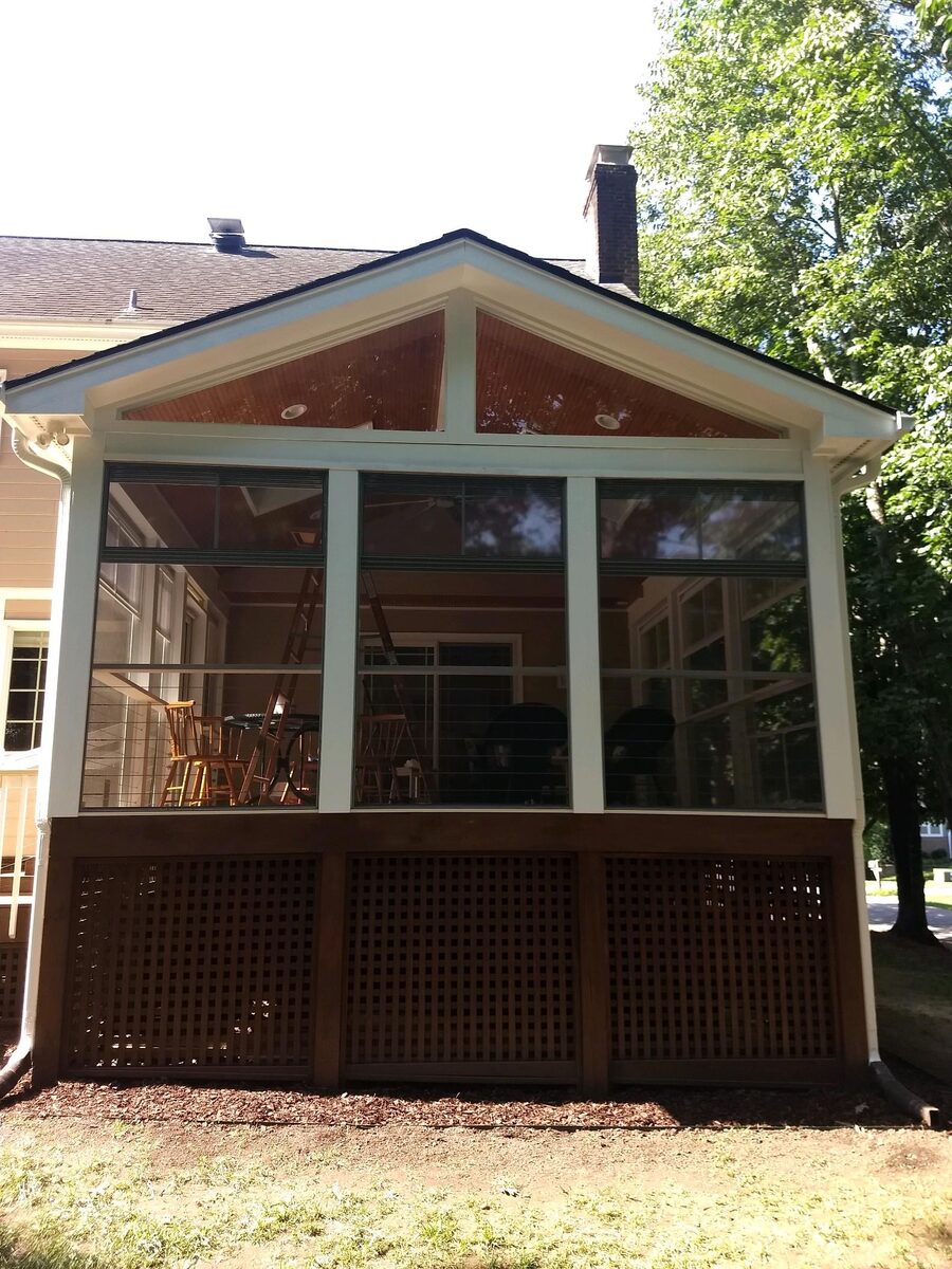Screened porch with gable roof and lattice skirting