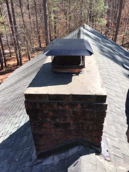 Brick chimney on a shingle roof