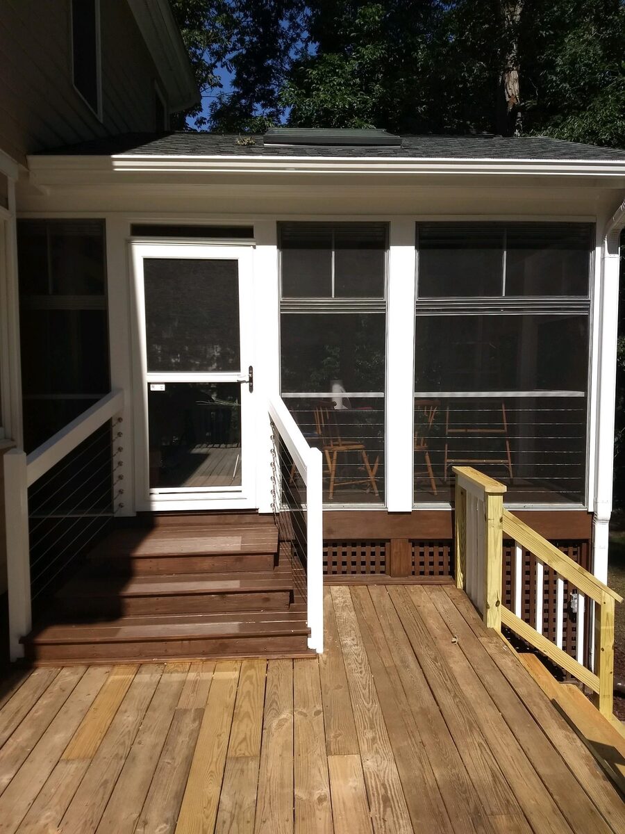 Screened porch door with wood deck steps