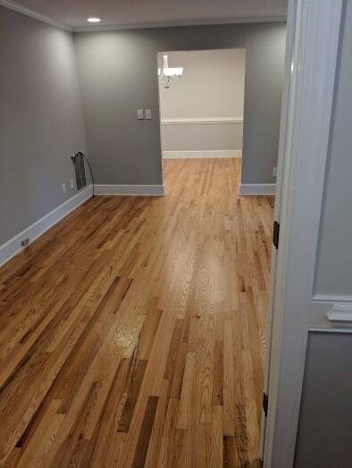 Gray-walled room with hardwood floors