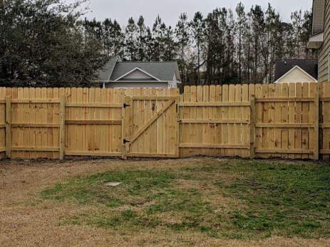 Wood privacy fence with gate