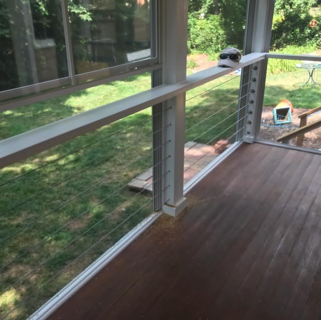 Deck viewed from inside a screened porch