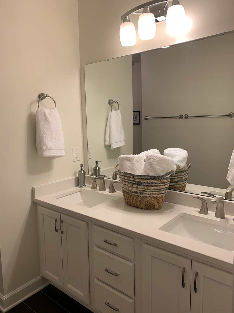 Bathroom with double vanity and large mirror
