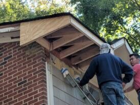 Crew framing a gable roof overhang