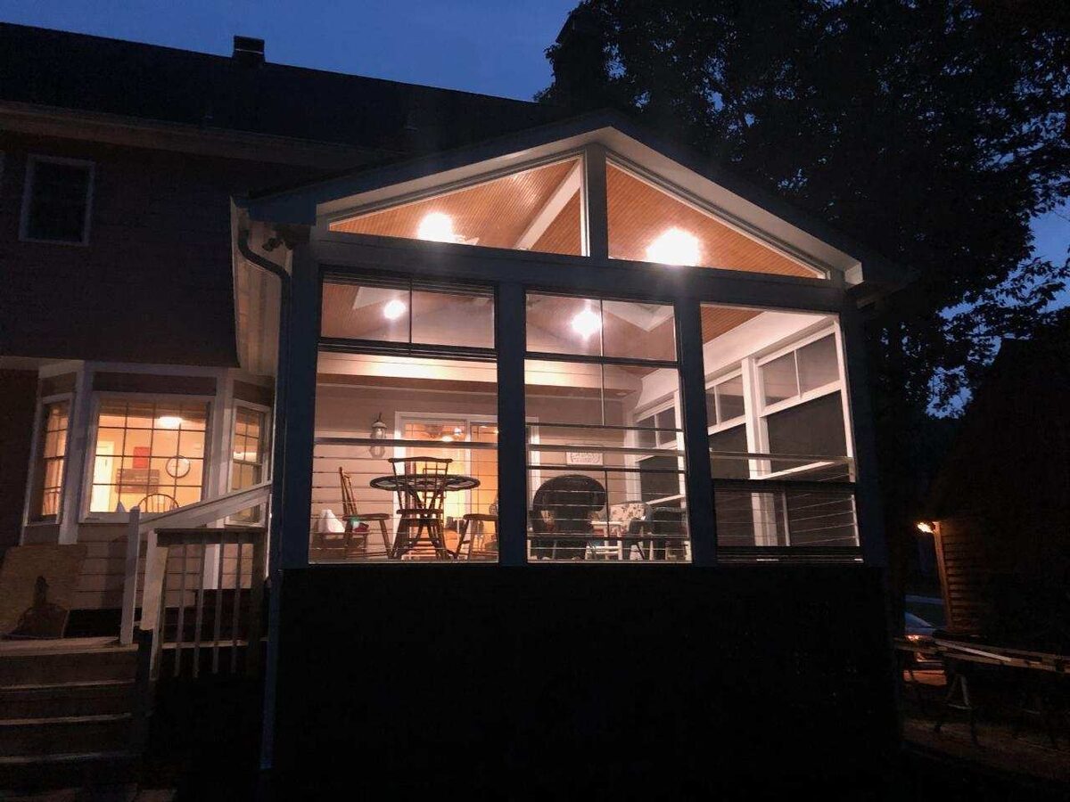 Screened porch lit at night