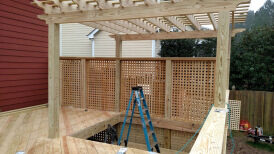 Pergola and lattice screen under construction